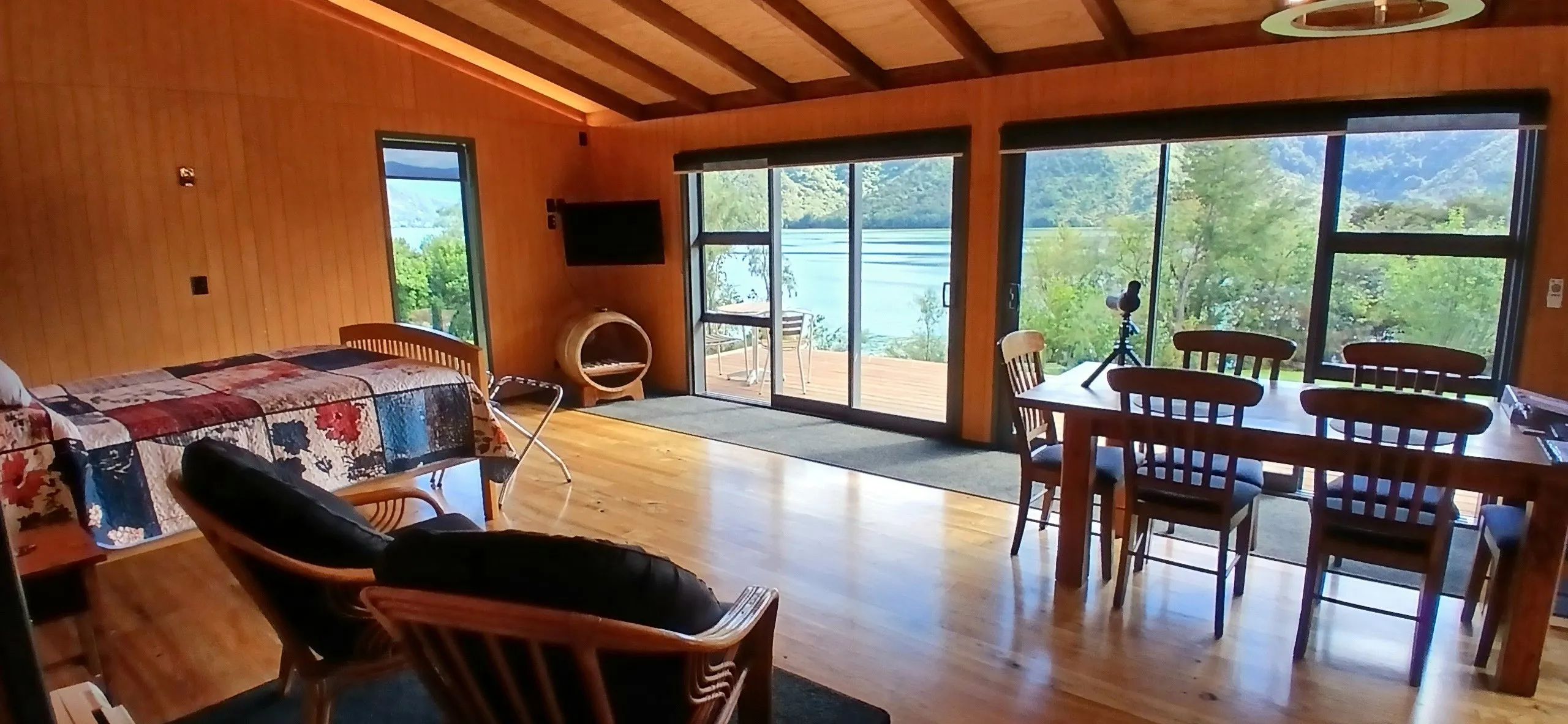 A bright, airy bedroom with twin chairs and clerestory windows