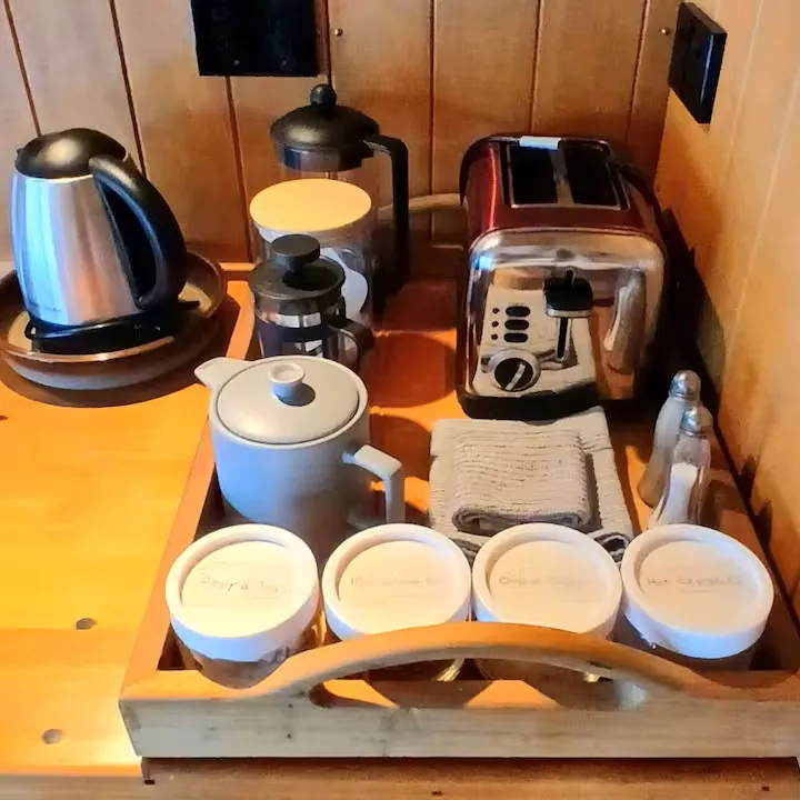 The tea and coffee station with kettle, plunger and toaster